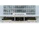 Welcoming entrance to The Aliki Atrium features modern architecture, landscaping and glass doors at 901 S Atlantic Ave # 202, Ormond Beach, FL 32176