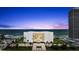 An exterior shot of the building featuring an ocean view, landscaping, and a beautiful skyline at 901 S Atlantic Ave # 202, Ormond Beach, FL 32176