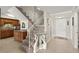 Warm foyer with stairs, neutral tones, and view of the kitchen at 901 S Atlantic Ave # 202, Ormond Beach, FL 32176