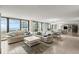 Bright, airy living room with ocean views, tile floors, and comfortable seating at 901 S Atlantic Ave # 202, Ormond Beach, FL 32176