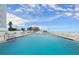 Inviting in-ground pool with lounge chairs offers residents a relaxing beachside retreat at 901 S Atlantic Ave # 202, Ormond Beach, FL 32176