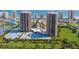 A stunning aerial view of the beachfront condo community, featuring lush landscaping, pool and ocean views at 1 Oceans West Blvd # 1B5, Daytona Beach, FL 32118