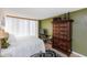 Cozy bedroom featuring a large armoire and natural light from big windows at 1 Oceans West Blvd # 1B5, Daytona Beach, FL 32118
