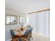 Bright dining area with matching table and chairs; large bright window at 1 Oceans West Blvd # 1B5, Daytona Beach, FL 32118