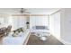 Bright living room offers comfortable seating and a modern ceiling fan, creating an inviting space for relaxation at 1 Oceans West Blvd # 1B5, Daytona Beach, FL 32118
