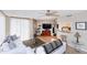 Cozy living room features a ceiling fan, comfortable seating, stylish decor, and a pass through to the kitchen at 1 Oceans West Blvd # 1B5, Daytona Beach, FL 32118
