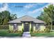 Charming single-story home featuring a well-manicured lawn and neutral-toned facade with a gray roof at 1042 Gary Blvd, Daytona Beach, FL 32119