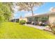 Nice backyard with healthy grass, mature shade trees, and a patio for relaxing at 1237 Charter Oaks Cir, Daytona Beach, FL 32117