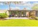 Private backyard patio with outdoor seating, perfect for relaxation and entertaining at 1237 Charter Oaks Cir, Daytona Beach, FL 32117