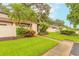 Charming front yard with healthy green grass, a sidewalk, and well-maintained landscaping at 1237 Charter Oaks Cir, Daytona Beach, FL 32117