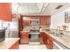 Modern kitchen showcasing stainless steel appliances, granite countertops, and ample cabinetry at 1237 Charter Oaks Cir, Daytona Beach, FL 32117