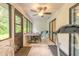 Bright sunroom with lots of windows, tile flooring, and outdoor access at 1237 Charter Oaks Cir, Daytona Beach, FL 32117