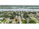 Aerial view showcases a charming neighborhood with waterfront access and lush greenery at 132 E Turgot Ave, Edgewater, FL 32132