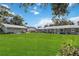 Spacious green backyard with well-maintained lawn and lush landscaping at 132 E Turgot Ave, Edgewater, FL 32132