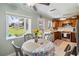 Bright kitchen featuring wood cabinets, stainless steel appliances, and an adjacent dining area at 132 E Turgot Ave, Edgewater, FL 32132