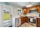 Functional kitchen boasts stainless steel appliances and bright white countertops, perfect for cooking at 132 E Turgot Ave, Edgewater, FL 32132