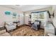 Cozy living room featuring a comfortable armchair and natural light from the window at 132 E Turgot Ave, Edgewater, FL 32132