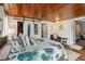 Spacious main bedroom with beautiful wood-paneled ceiling and ample natural light at 132 E Turgot Ave, Edgewater, FL 32132