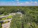 Bird's eye view of the neighborhood with mature trees and well-maintained homes at 1421 Pine Tree Dr, Edgewater, FL 32132