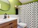 Stylish bathroom featuring modern fixtures, a wood vanity, and a shower with sun-patterned curtain at 1421 Pine Tree Dr, Edgewater, FL 32132