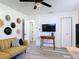 Bright bedroom with a ceiling fan, large windows, with an additional tv-viewing area and closet at 1421 Pine Tree Dr, Edgewater, FL 32132