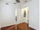 Bedroom with hardwood floors, walk-in closet, and white trim at 156 S State Road 415, New Smyrna Beach, FL 32168