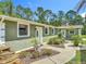 A well-maintained home with a beautiful walkway and lush landscaping at 156 S State Road 415, New Smyrna Beach, FL 32168