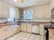 Functional kitchen with ample counter space and stainless steel dishwasher at 156 S State Road 415, New Smyrna Beach, FL 32168