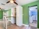 Eat-in kitchen with updated cabinets and access to both laundry room and backyard at 156 S State Road 415, New Smyrna Beach, FL 32168