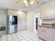 White cabinetry and stainless steel appliances in an open kitchen layout at 156 S State Road 415, New Smyrna Beach, FL 32168