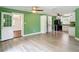 Open layout featuring wood-look flooring connecting the kitchen and dining at 156 S State Road 415, New Smyrna Beach, FL 32168