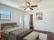 Cozy main bedroom showcasing an en-suite bathroom and outdoor access at 156 S State Road 415, New Smyrna Beach, FL 32168