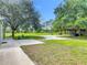 Spacious backyard featuring lush greenery and ample room to roam at 156 S State Road 415, New Smyrna Beach, FL 32168