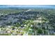Wide aerial shot of a neighborhood with tree-lined streets and single-story homes at 1903 Willow Oak Dr, Edgewater, FL 32141