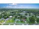 Aerial view of a home in a neighborhood with mature trees and landscaping at 1903 Willow Oak Dr, Edgewater, FL 32141