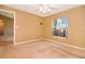 Inviting bedroom with neutral carpet, a window providing natural light, and a ceiling fan at 1903 Willow Oak Dr, Edgewater, FL 32141