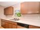 Kitchen view showcasing stainless steel sink, sleek dishwasher, and white countertop at 1903 Willow Oak Dr, Edgewater, FL 32141