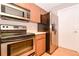 Well-equipped kitchen featuring stainless steel appliances and ample cabinet space for storage at 1903 Willow Oak Dr, Edgewater, FL 32141