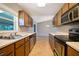 Spacious kitchen featuring updated appliances and tile flooring with adjacent dining area at 1903 Willow Oak Dr, Edgewater, FL 32141