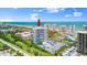 Aerial view showcasing a high-rise condo building with resort-style amenities and ocean views at 2 Oceans West Blvd # 206, Daytona Beach Shores, FL 32118