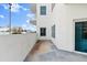 Spacious balcony featuring partial city views, an exterior of a building with a white facade at 2 Oceans West Blvd # 206, Daytona Beach Shores, FL 32118