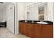 Modern bathroom with double sink vanity, granite countertop and updated lighting fixtures at 2 Oceans West Blvd # 206, Daytona Beach Shores, FL 32118