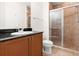 Bathroom featuring a vanity and a tile shower with glass door at 2 Oceans West Blvd # 206, Daytona Beach Shores, FL 32118