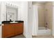 Bright bathroom featuring a tub shower at 2 Oceans West Blvd # 206, Daytona Beach Shores, FL 32118