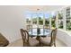 Bright breakfast nook with large windows and a chandelier at 2 Oceans West Blvd # 206, Daytona Beach Shores, FL 32118