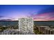 Stunning high-rise building with waterfront views at sunset at 2 Oceans West Blvd # 206, Daytona Beach Shores, FL 32118