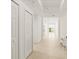 Bright hallway featuring tile floors and closet space at 2 Oceans West Blvd # 206, Daytona Beach Shores, FL 32118