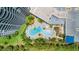 A gorgeous condo pool surrounded by lush greenery and palm trees, perfect for relaxation at 2 Oceans West Blvd # 206, Daytona Beach Shores, FL 32118
