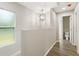 Hallway with a window and a view of the bathroom at 2005 Sunny Ln, New Smyrna Beach, FL 32168