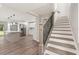 Modern kitchen with stainless steel appliances and a staircase in view at 2005 Sunny Ln, New Smyrna Beach, FL 32168